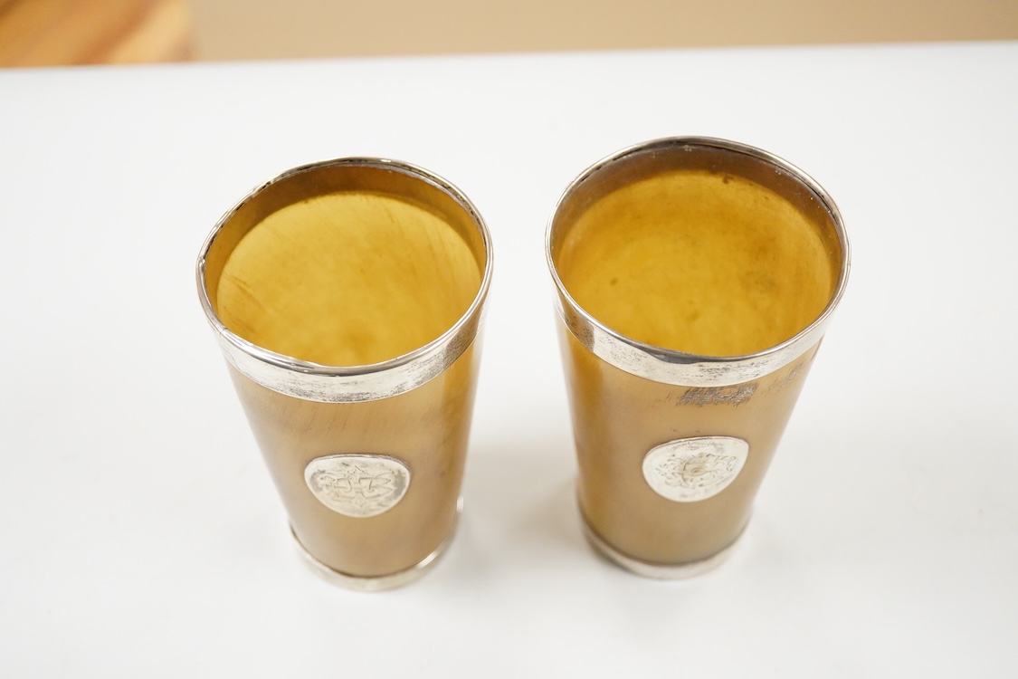 A pair of late Victorian silver mounted horn beakers, Thomas Johnson II, London, 1879, 13.4cm, (a.f.).